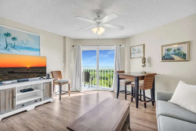a view of a livingroom with furniture window and wooden floor