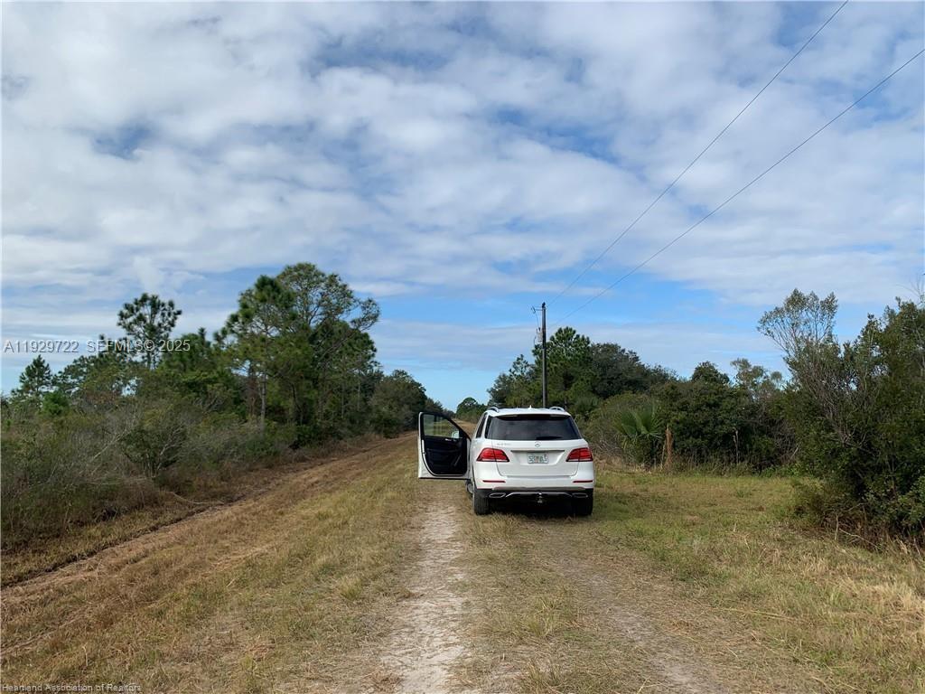 16122 Northwest 318th Street Okeechobee, FL 34972 - Photo 12 of 13 a car parked in front of a house
