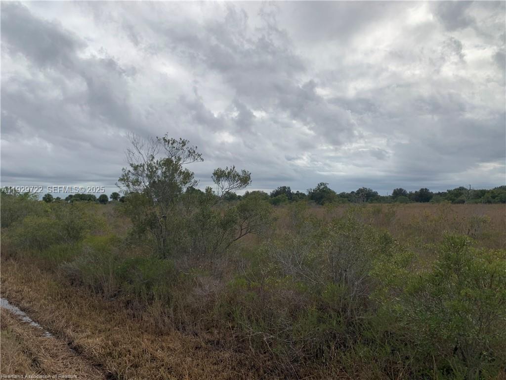 16122 Northwest 318th Street Okeechobee, FL 34972 - Photo 9 of 13 a view of a lake and mountains