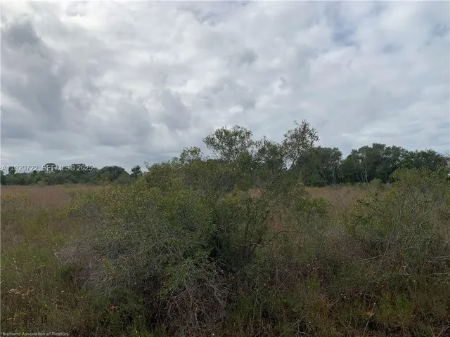 a view of lake with green space