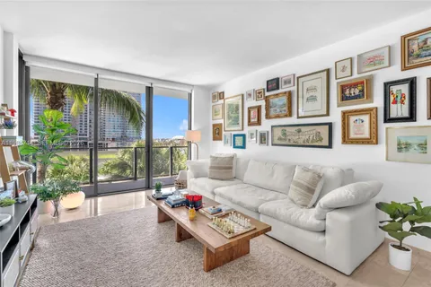 a couple of palm trees in front of yellow room