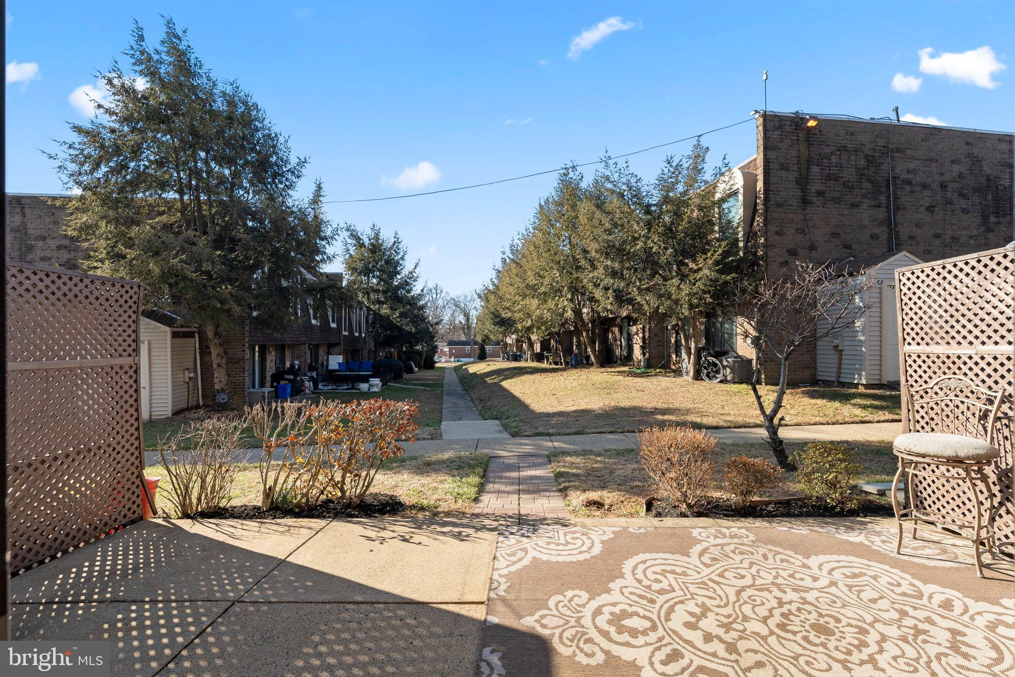 11849B Academy Road, Unit C4 Philadelphia, PA 19154 - Photo 27 of 30 Serene courtyard with lush greenery.