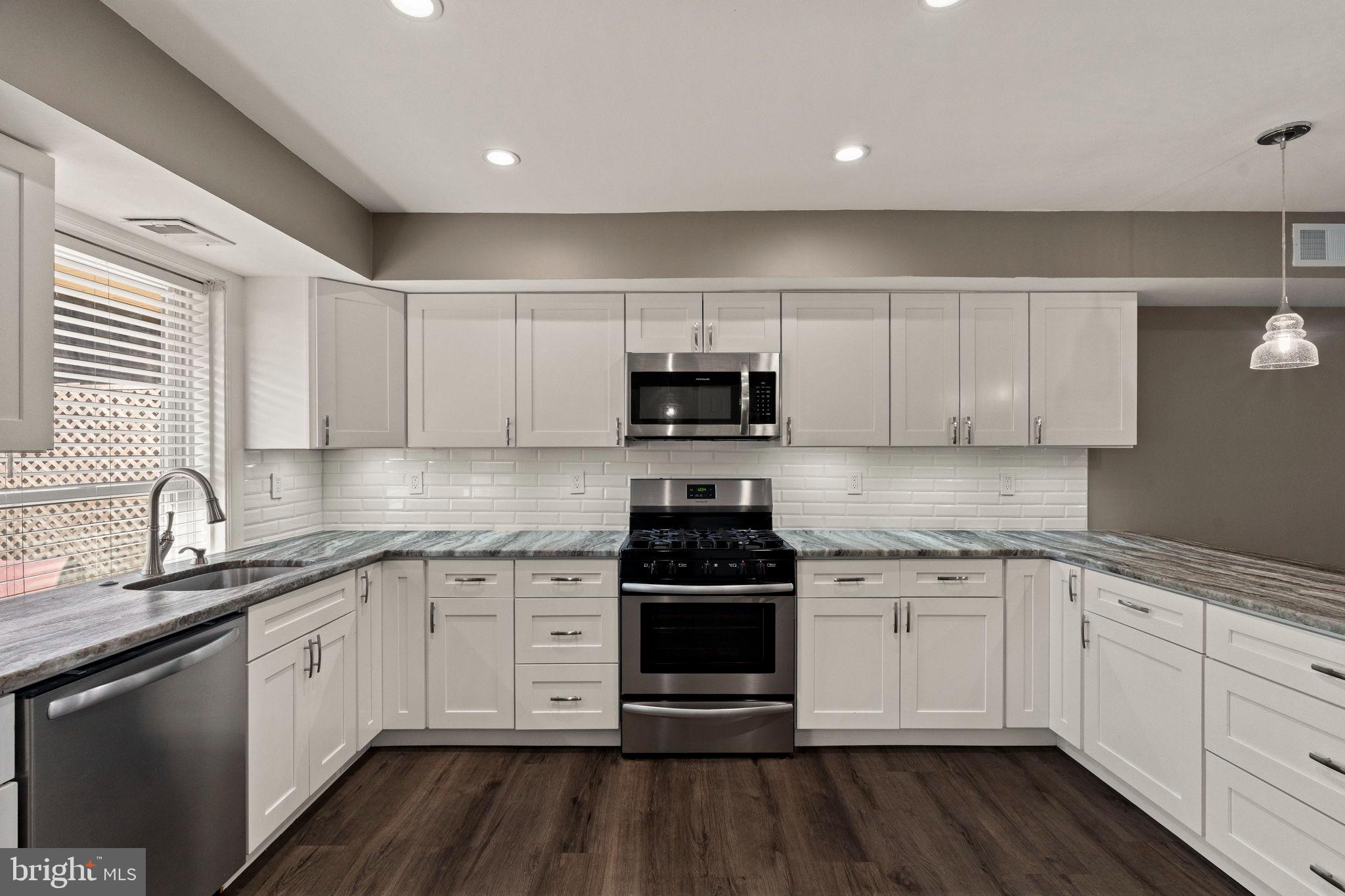 11849B Academy Road, Unit C4 Philadelphia, PA 19154 - Photo 3 of 30 Modern kitchen with sleek cabinetry and style.