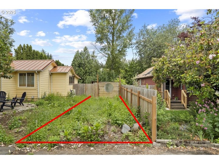 5581 Northeast Simpson Street Portland, OR 97218 - Photo 5 of 9 a view of backyard with green space