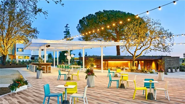 a view of a swimming pool with an outdoor seating