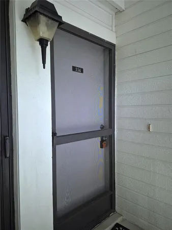 a bathroom with a glass door shower and vanity