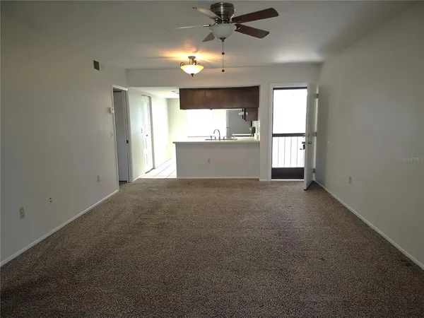 a view of an empty room with a window