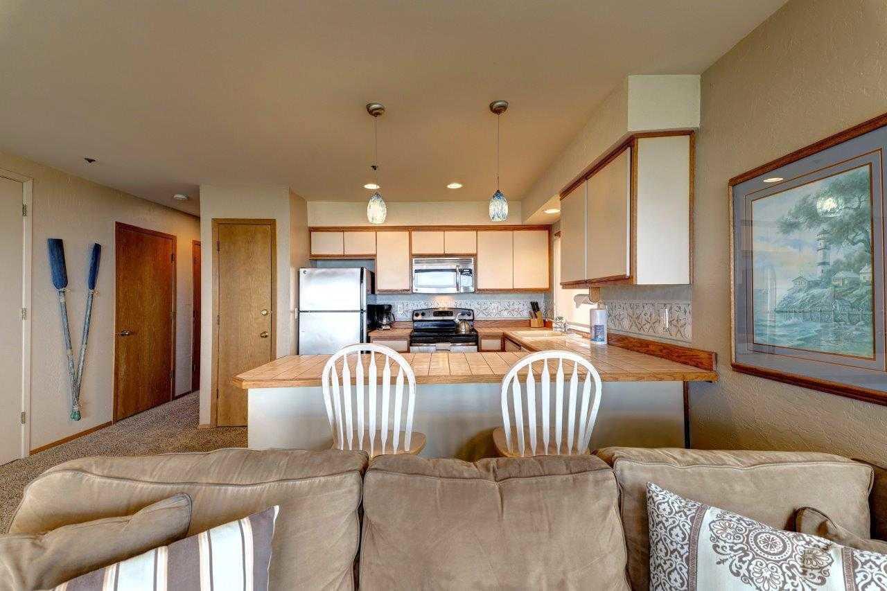 561 South Promenade Seaside, OR 97138 - Photo 11 of 35 Beach Club condo living room to kitchen