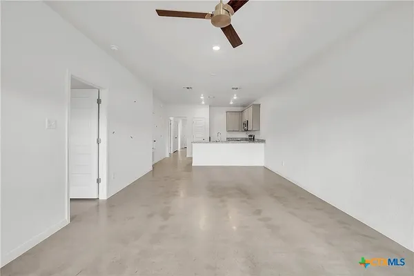 a view of a kitchen with a sink and cabinets