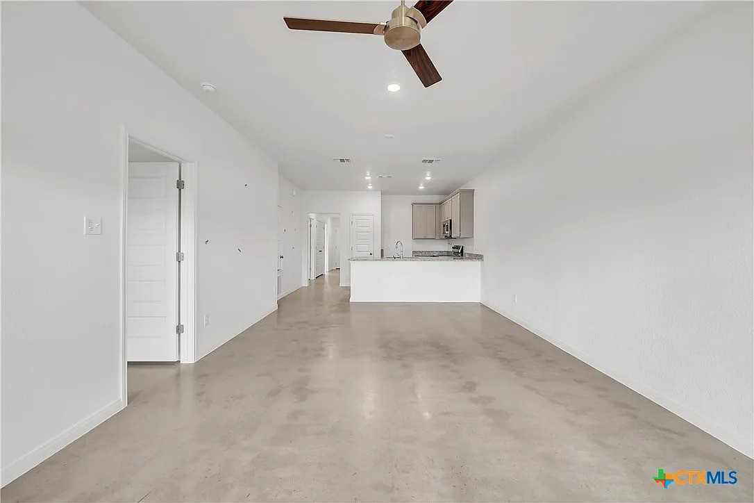 908 Smoke Tree Lane, Unit A Killeen, TX 76543 - Photo 2 of 13 a view of a kitchen with a sink and cabinets