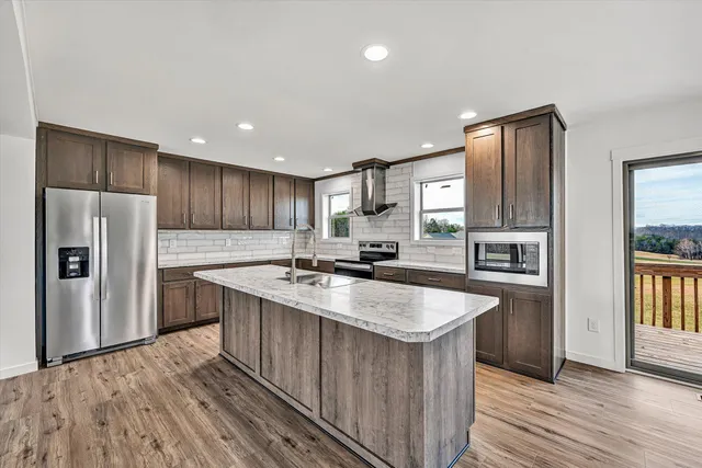 a bathroom with a white bath tub and a shower