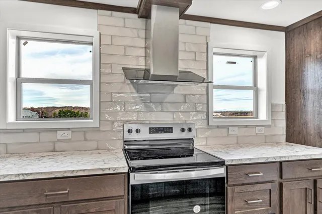 a hallway with sliding door and natural light