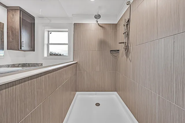 a street sign that is sitting on a wooden wall