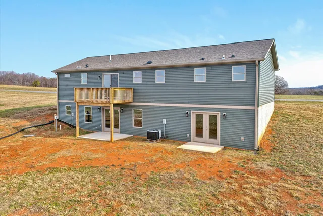 a view of a kitchen with wooden floor and a window