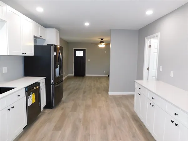 a view of kitchen with wooden floor