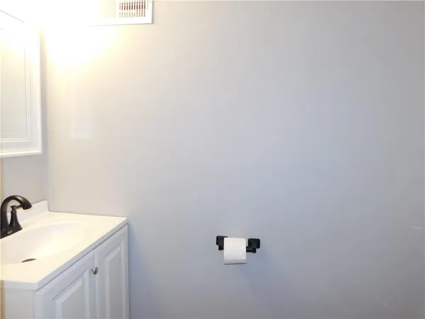 a bathroom with a sink and mirror