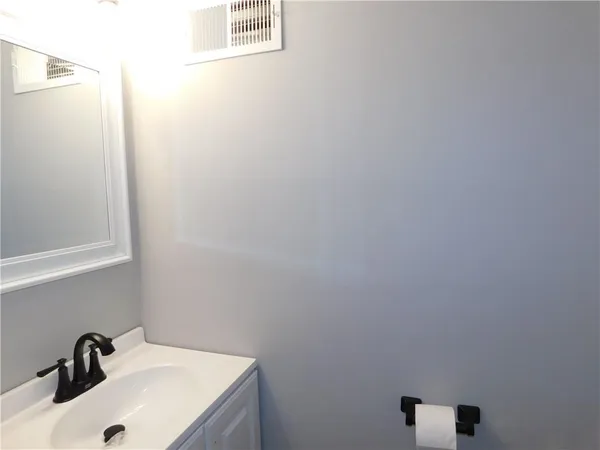 a bathroom with a sink and a vanity