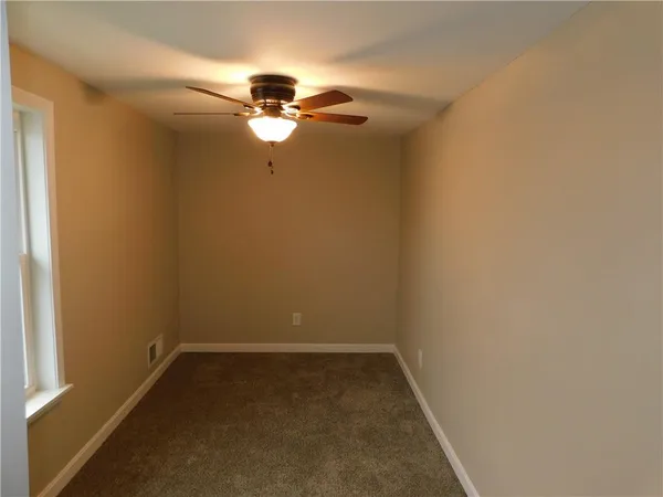 a view of a small space with a fan