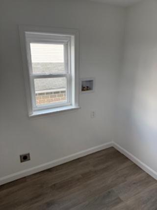 408 3rd Street Allison, PA 15413 - Photo 32 of 40 an empty room with wooden floor and a window