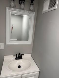 408 3rd Street Allison, PA 15413 - Photo 39 of 40 a bathroom with a sink and mirror