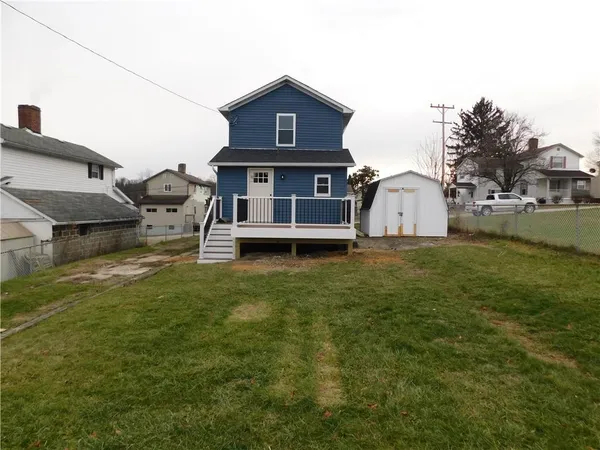 a view of a house with a big yard