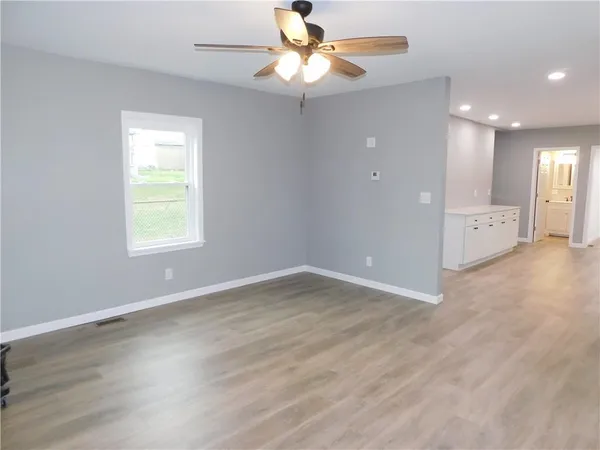 a view of an empty room with a window