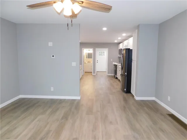 a view of a livingroom with wooden floor