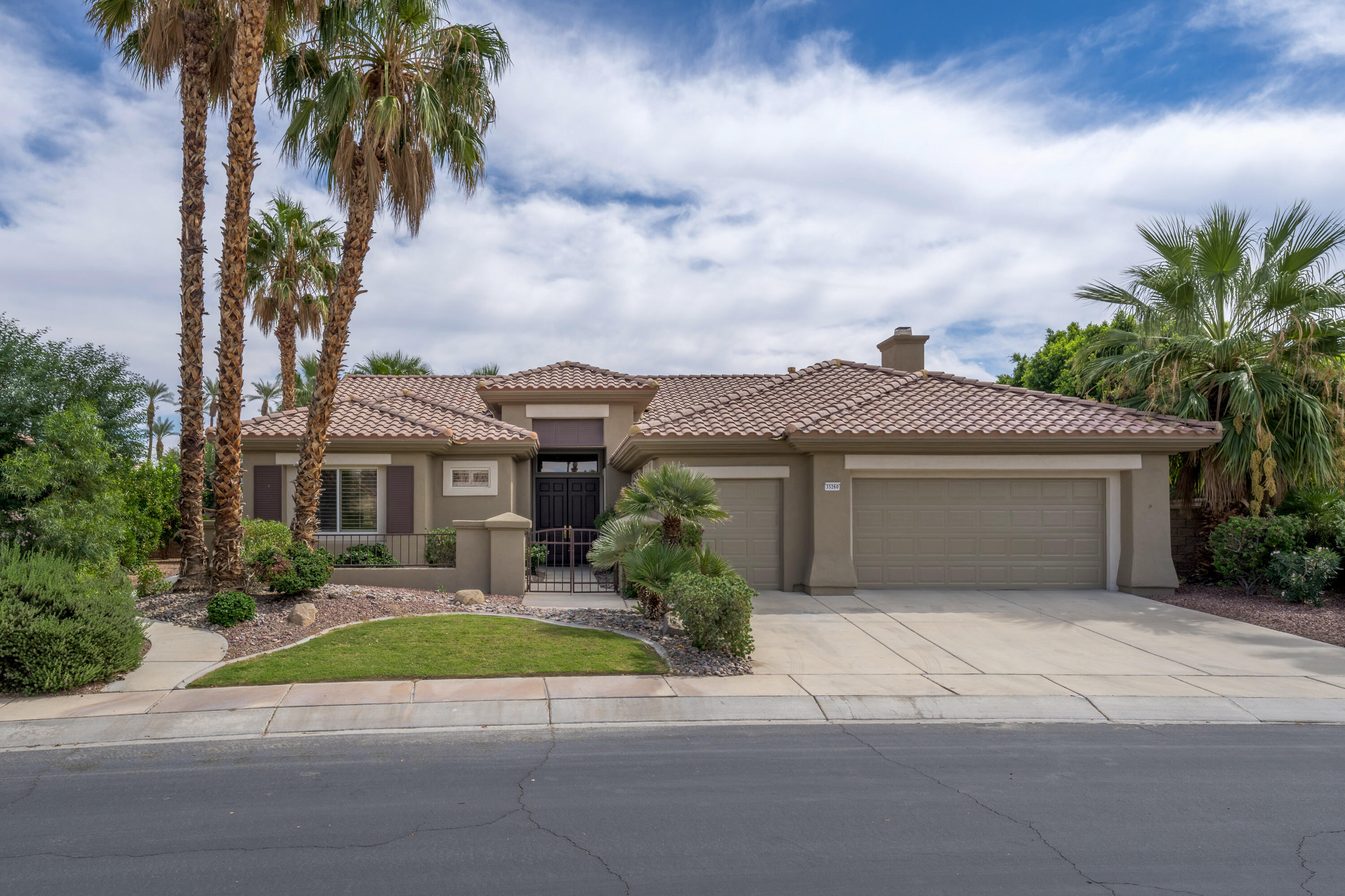 35260 Monarch Way Palm Desert, CA 92211 - Photo 1 of 44 front view of house with a yard