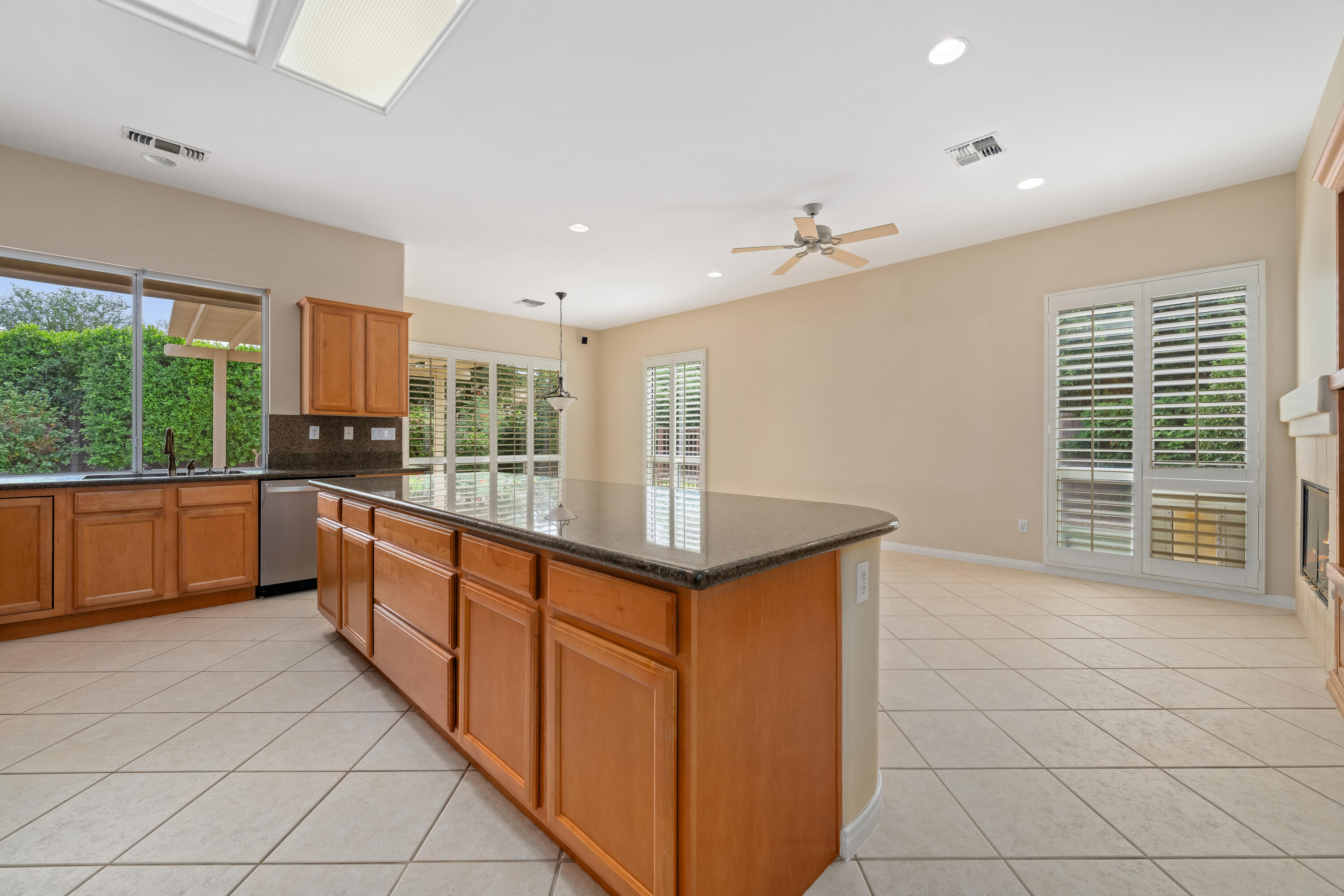 35260 Monarch Way Palm Desert, CA 92211 - Photo 17 of 44 a kitchen with stainless steel appliances granite countertop a stove a sink and a refrigerator