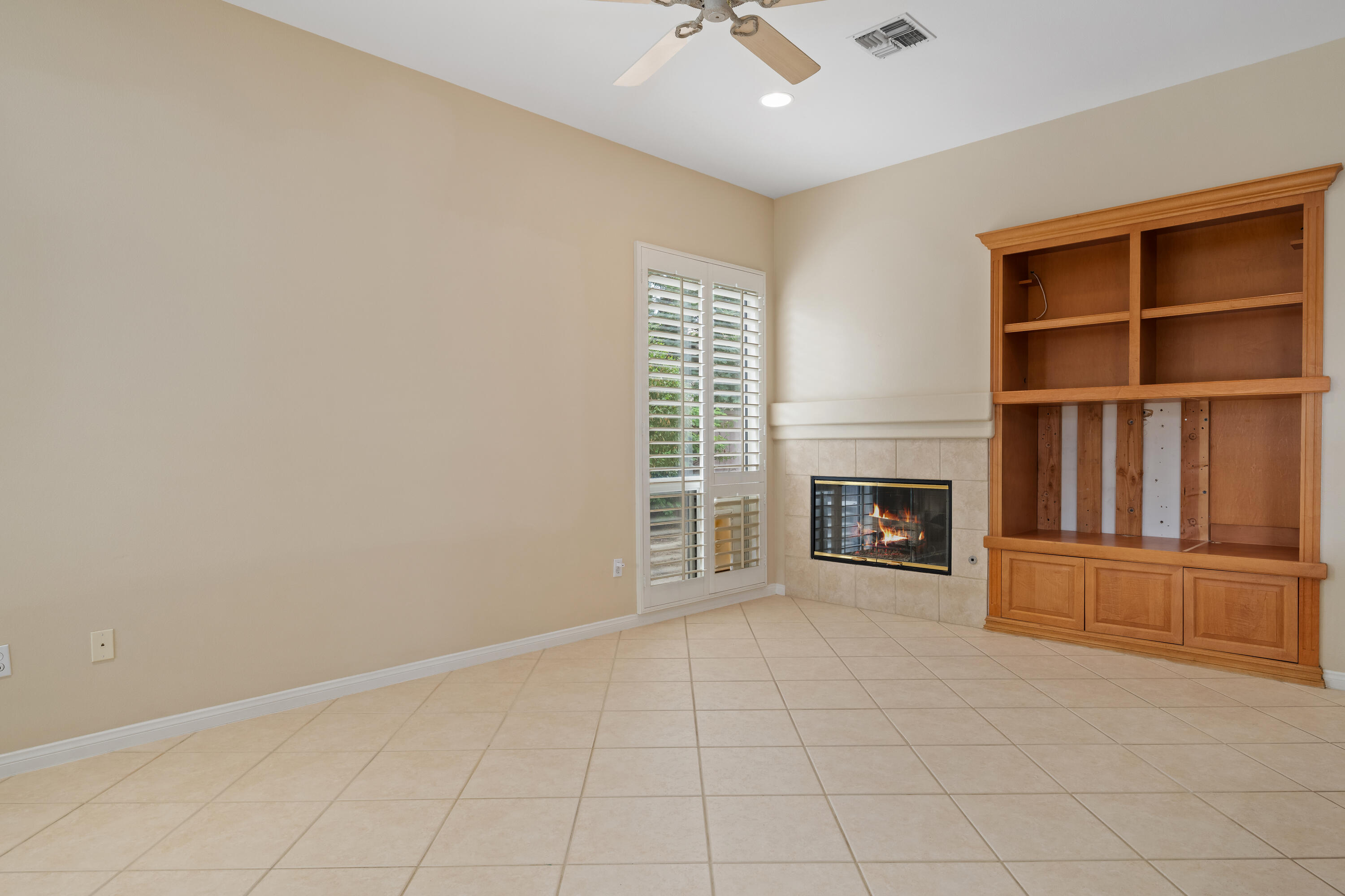 35260 Monarch Way Palm Desert, CA 92211 - Photo 23 of 44 an empty room with windows and fireplace
