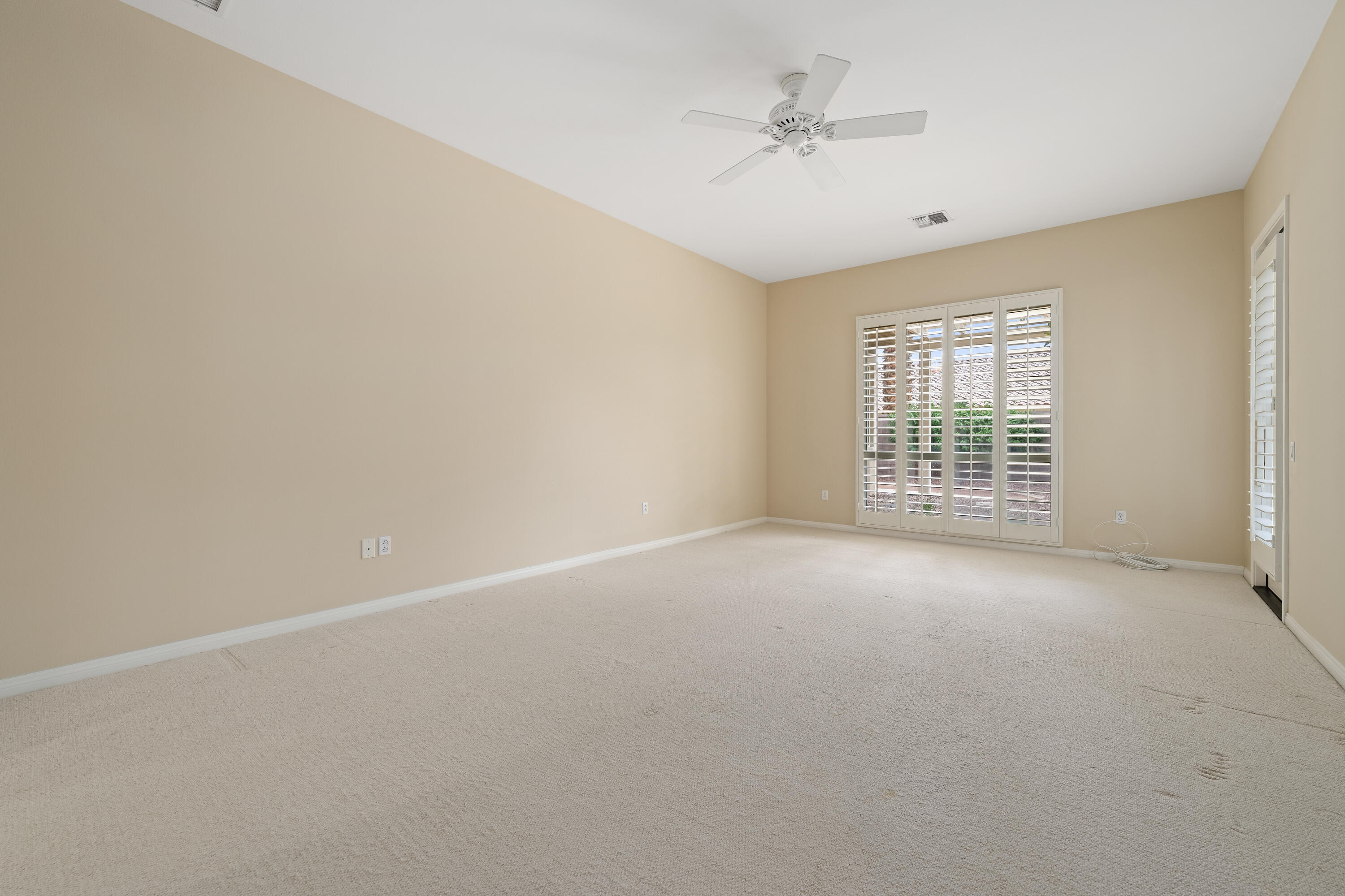 35260 Monarch Way Palm Desert, CA 92211 - Photo 29 of 44 a view of an empty room with a window