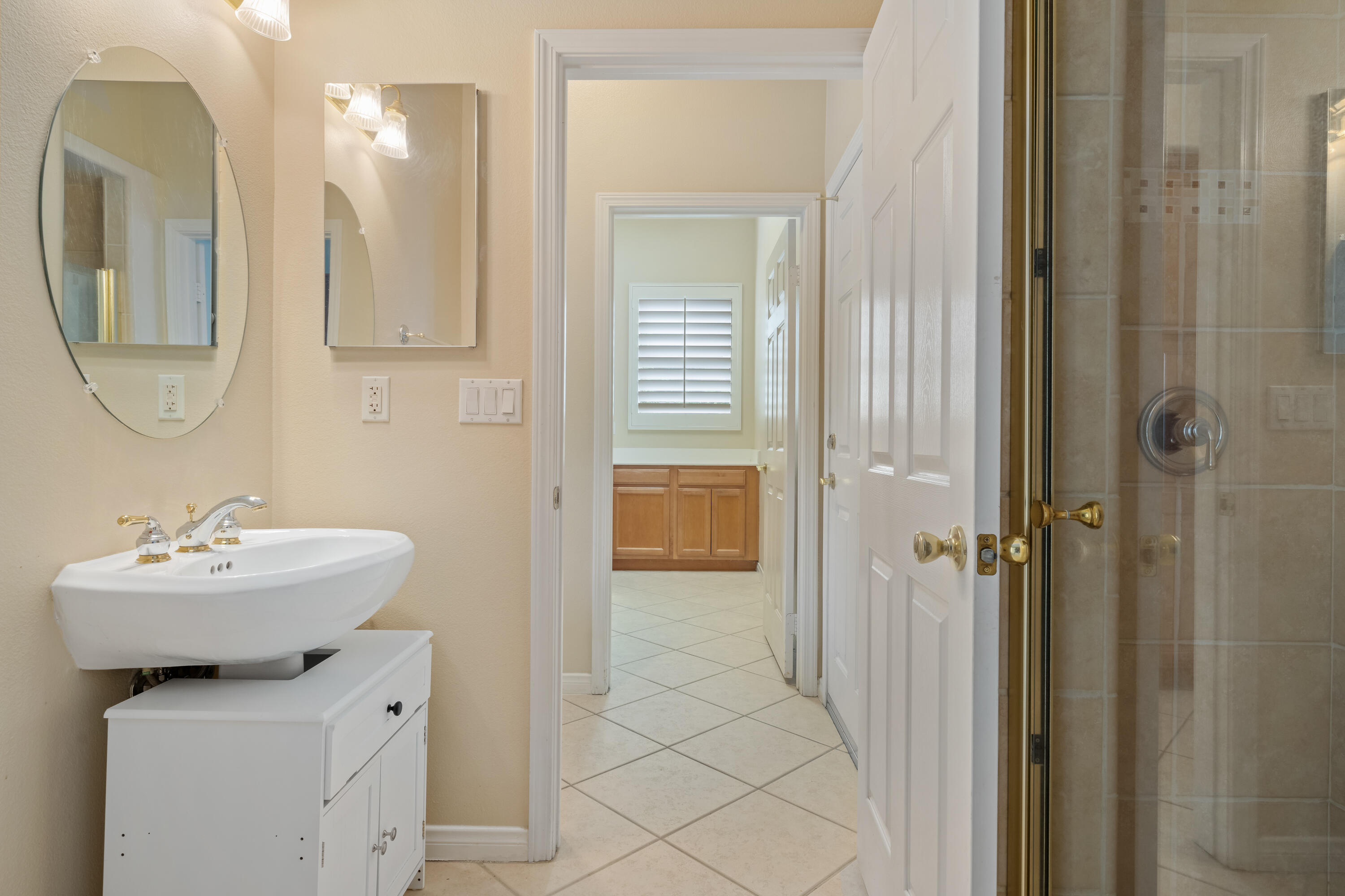 35260 Monarch Way Palm Desert, CA 92211 - Photo 35 of 44 a bathroom with a sink mirror and vanity