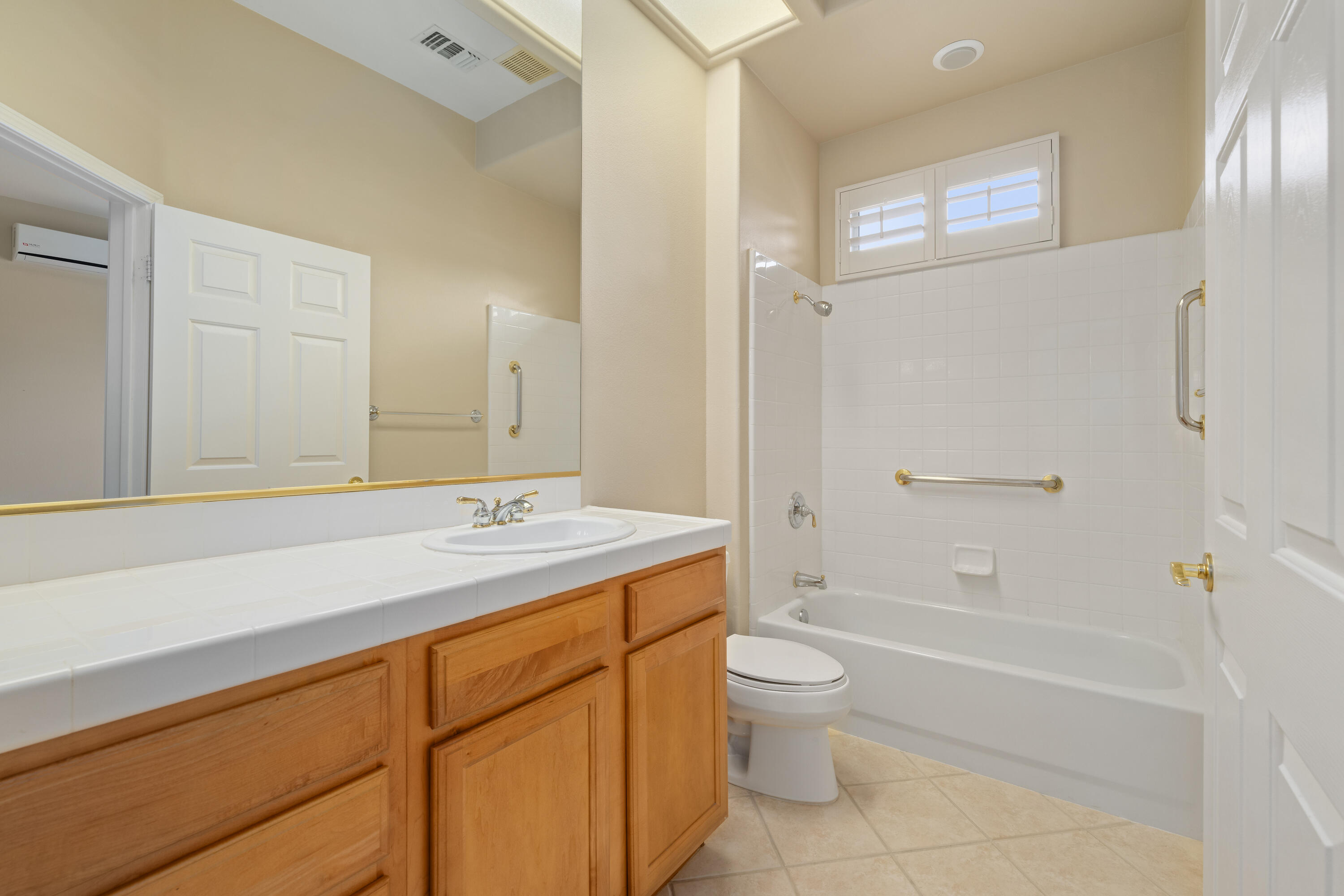 35260 Monarch Way Palm Desert, CA 92211 - Photo 38 of 44 a bathroom with a sink a toilet and bathtub