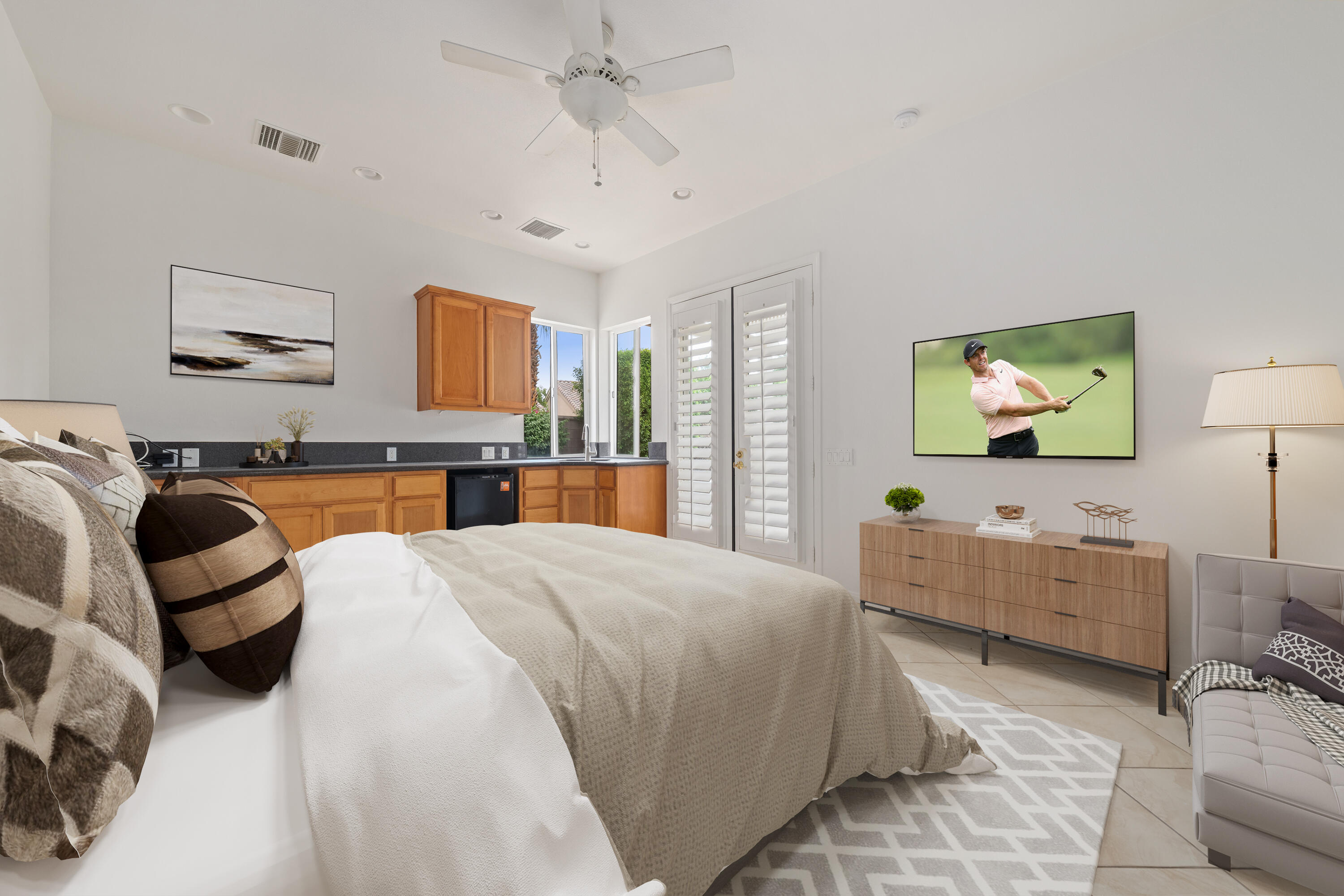 35260 Monarch Way Palm Desert, CA 92211 - Photo 39 of 44 a bedroom with a bed wooden floor and furniture