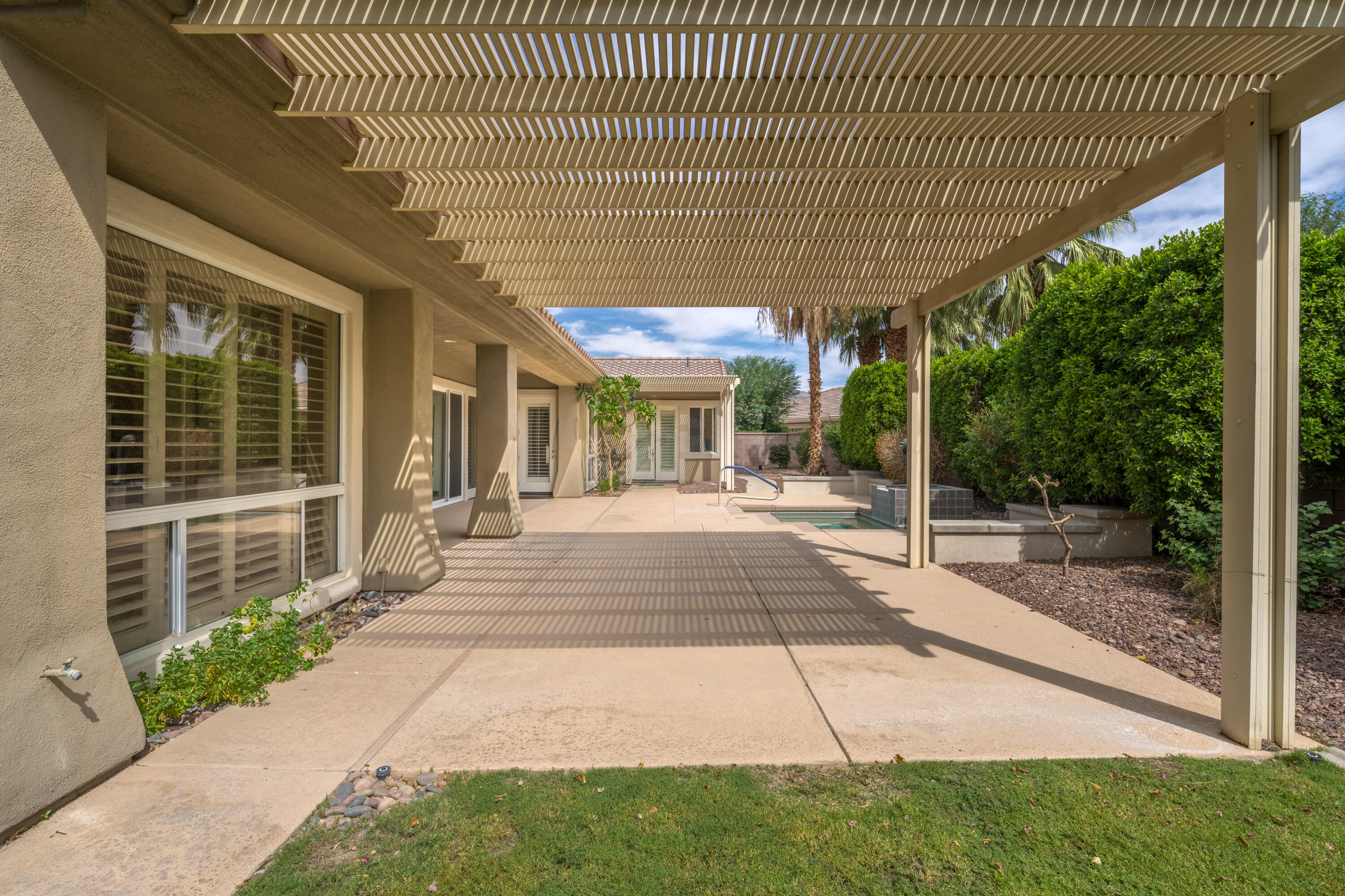 35260 Monarch Way Palm Desert, CA 92211 - Photo 5 of 44 a view of a patio with table and chairs with wooden floor and fence