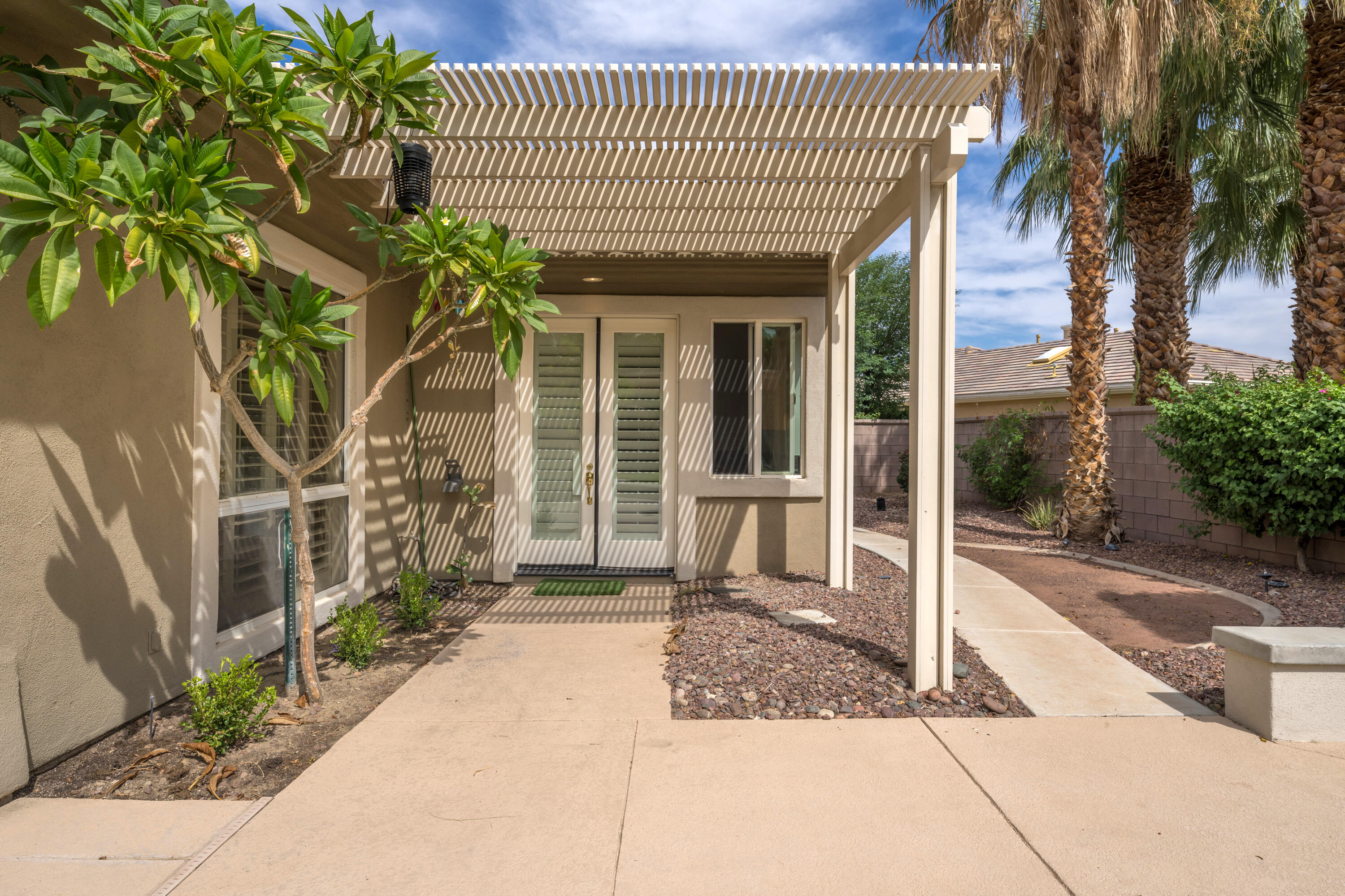 35260 Monarch Way Palm Desert, CA 92211 - Photo 6 of 44 a front view of a house with a garden