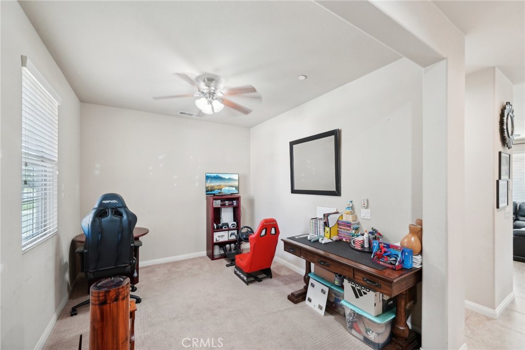 29259 Bouris Drive Menifee, CA 92584 - Photo 15 of 56 a bedroom with furniture and a gym equipment