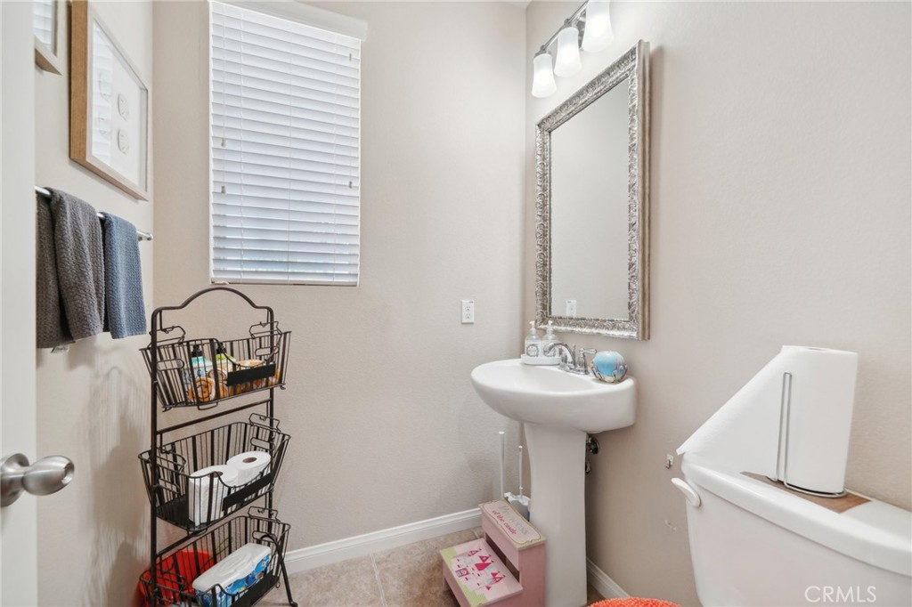 29259 Bouris Drive Menifee, CA 92584 - Photo 17 of 56 a bathroom with a sink a mirror and a window
