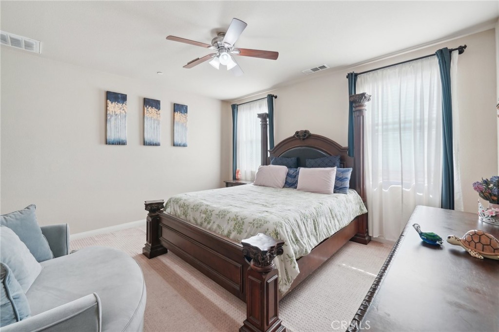 29259 Bouris Drive Menifee, CA 92584 - Photo 30 of 56 a bedroom with a bed mirror and window