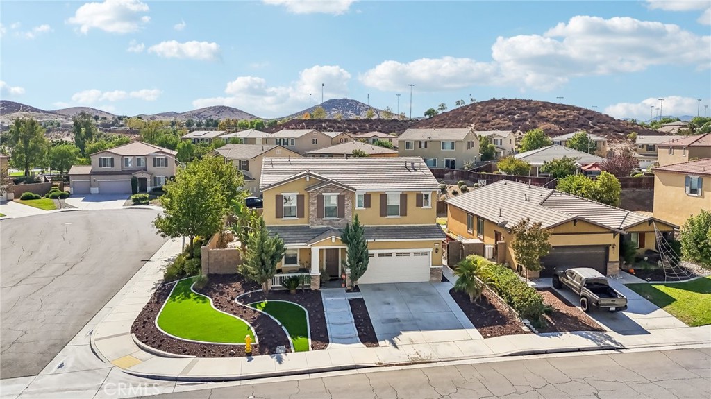 29259 Bouris Drive Menifee, CA 92584 - Photo 40 of 56 a aerial view of a house with swimming pool and mountains
