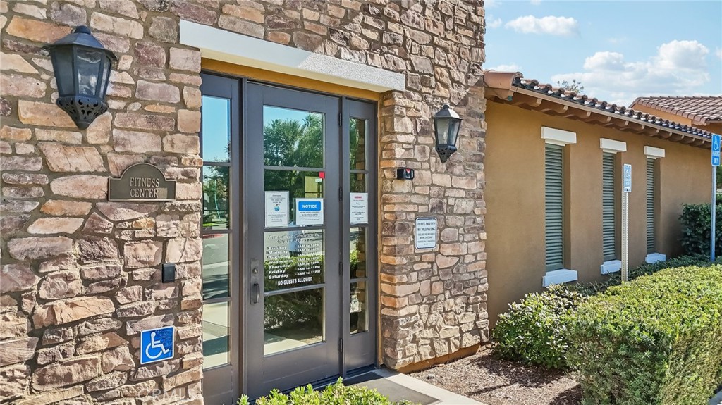 29259 Bouris Drive Menifee, CA 92584 - Photo 54 of 56 a front view of a house with a glass door