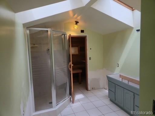 131 Hitchrack Road Bailey, CO 80421 - Photo 16 of 22 a bathroom with a bathtub and a shower