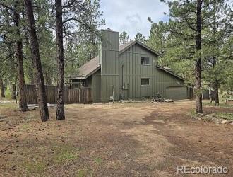 131 Hitchrack Road Bailey, CO 80421 - Photo 20 of 22 a house with trees in front of it