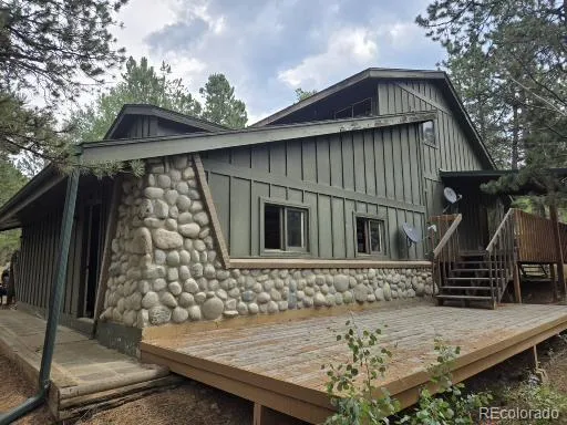 a view of two chairs in a yard