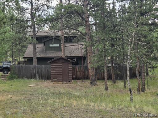 131 Hitchrack Road Bailey, CO 80421 - Photo 4 of 22 a front view of a house with a yard