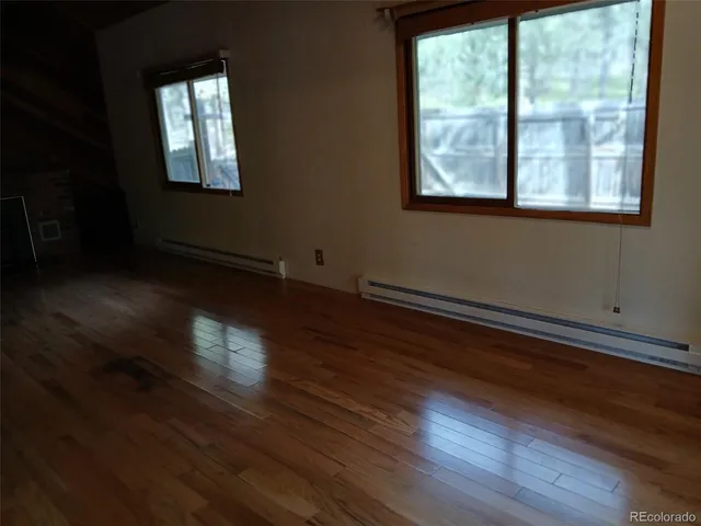 a view of empty room with a fireplace