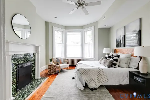 a bedroom with a bed and a mirror