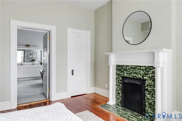 a living room with a sink and a mirror