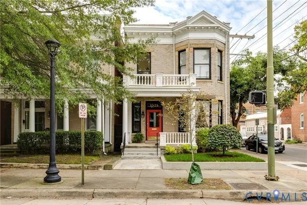 an aerial view of multiple houses with yard