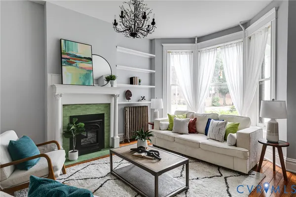 a living room with furniture and a fireplace